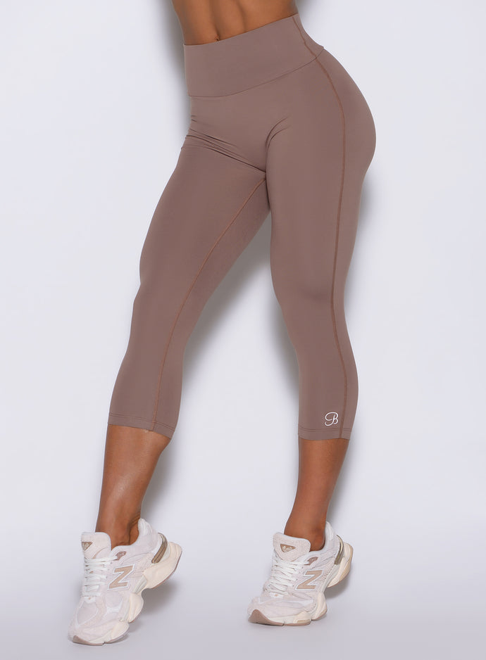 Close-up of the high-waisted Cocoa Smooth capris, providing a defined and sculpted shape