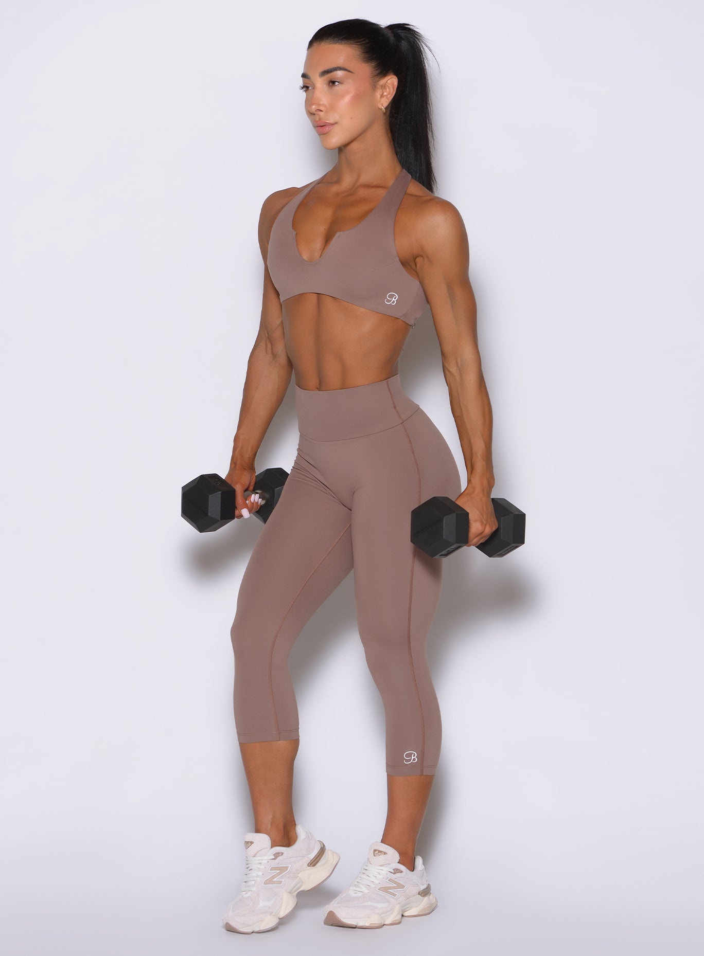 High-waisted cocoa capris with a sleek, sculpting athletic fit designed for all-day comfort