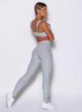 back right side profile view of a model wearing the Snape Flare Leggings in Ice Queen color