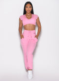 front profile view of a model wearing the Snap Rib Joggers in Pink Cupcake color