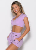 front left side profile view of a model wearing the Snap Top in Spring Fairy color