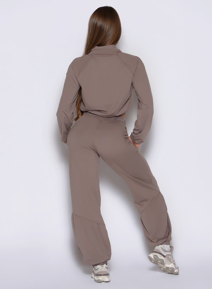back profile view of a model wearing the Society Joggers in Espresso color