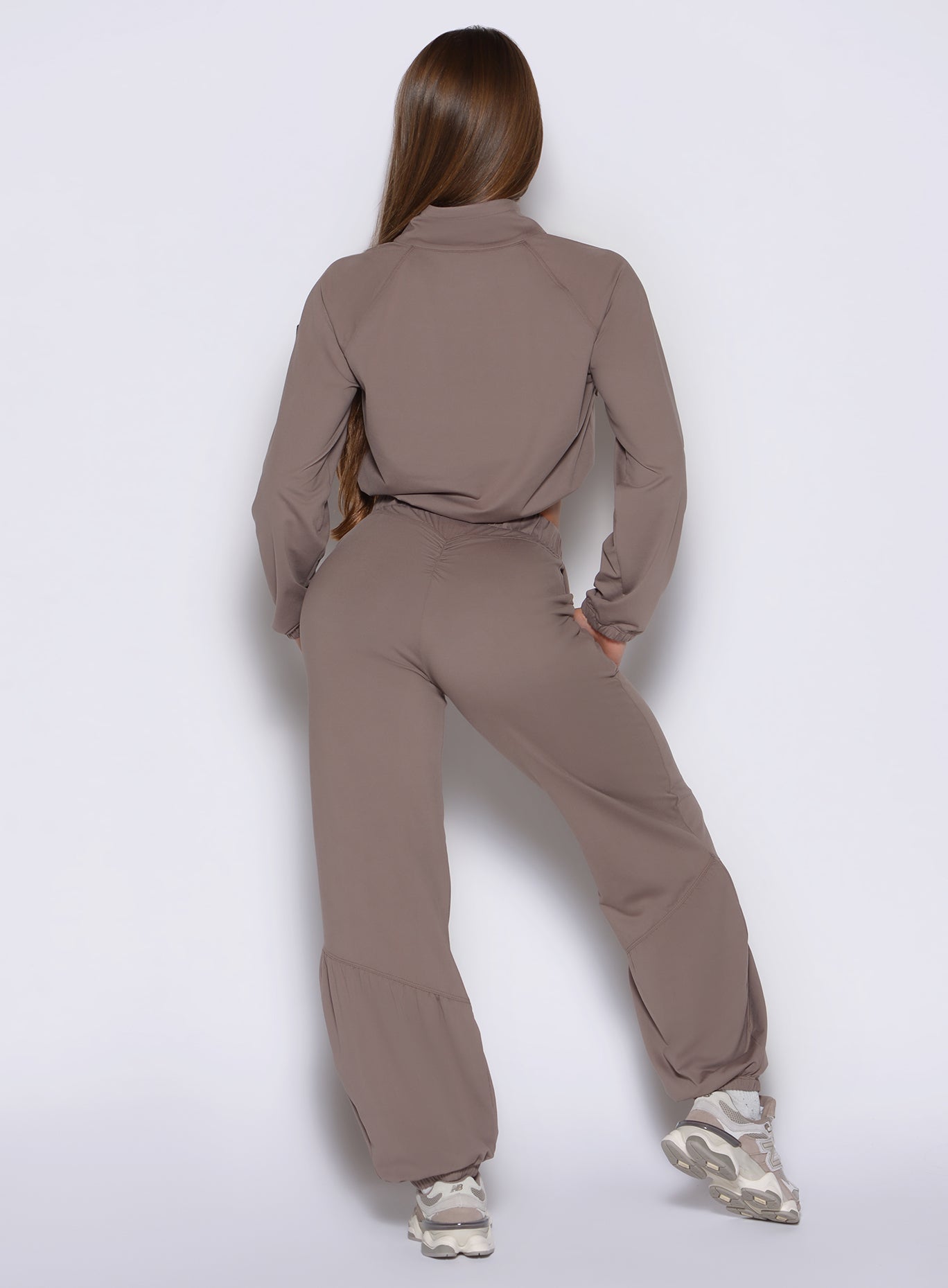 back profile view of a model wearing the Society Joggers in Espresso color