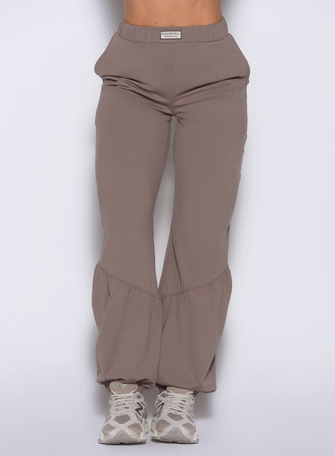 close up front view of a model wearing the Society Joggers in Espresso color