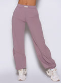 close up front view of a model wearing the Society Joggers in light mauve color