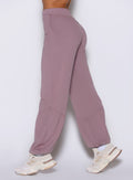 close up left side view of a model wearing the Society Joggers in light mauve color