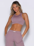 front view of a model wearing the Society Tank in light mauve color