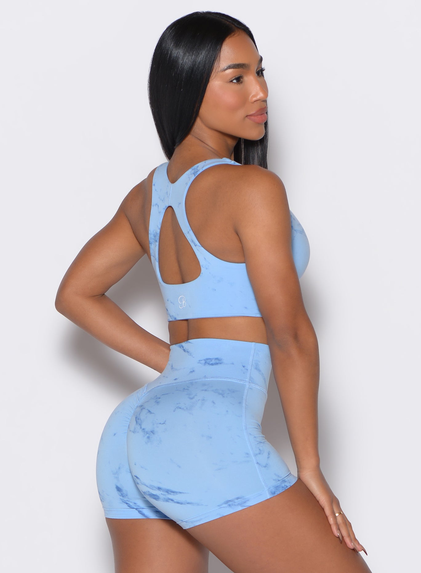 Back right side profile view of our model wearing the Square Neck Bra in Blue Jay color