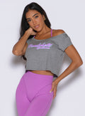 frontal view of a model with one hand on her thigh wearing the Star Power Tee in Core Gray color