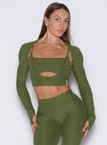 Juniper Studio Sculpt Bolero with thumbholes; a cropped layering piece to elevate your gym style.