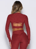 back side view of a model wearing the Studio Sculpt Bolero in Rouge color