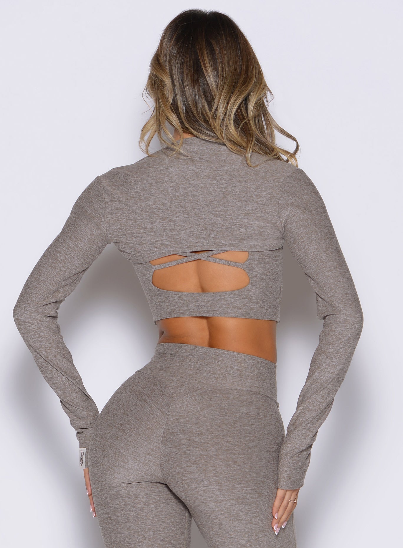 back side view of a model wearing the Studio Sculpt Bolero in smoked taupe color