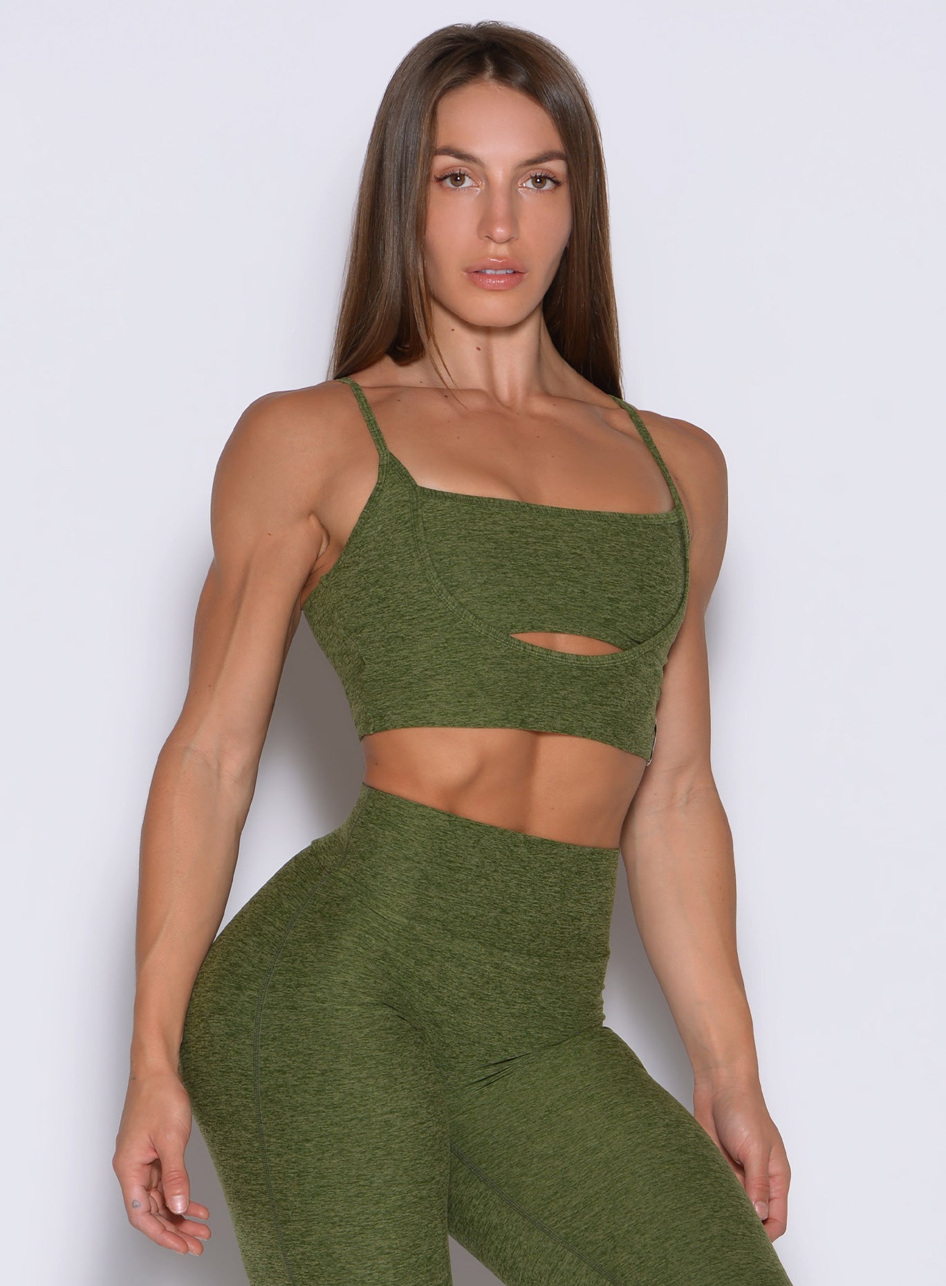 Studio Sculpt Bra in Juniper featuring a front cutout and curve-defining binding for Pilates sessions.