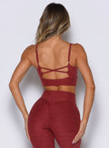 back profile view of a model wearing the Studio Sculpt Bra in Rouge color