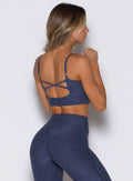 Space Blue Studio Sculpt Bra: Sleek strappy back and performance fabric for a sculpted gym look.