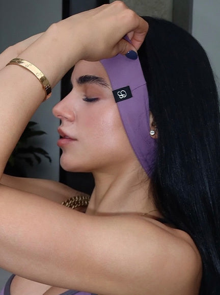 detailed close up shot of a model fixing her headband