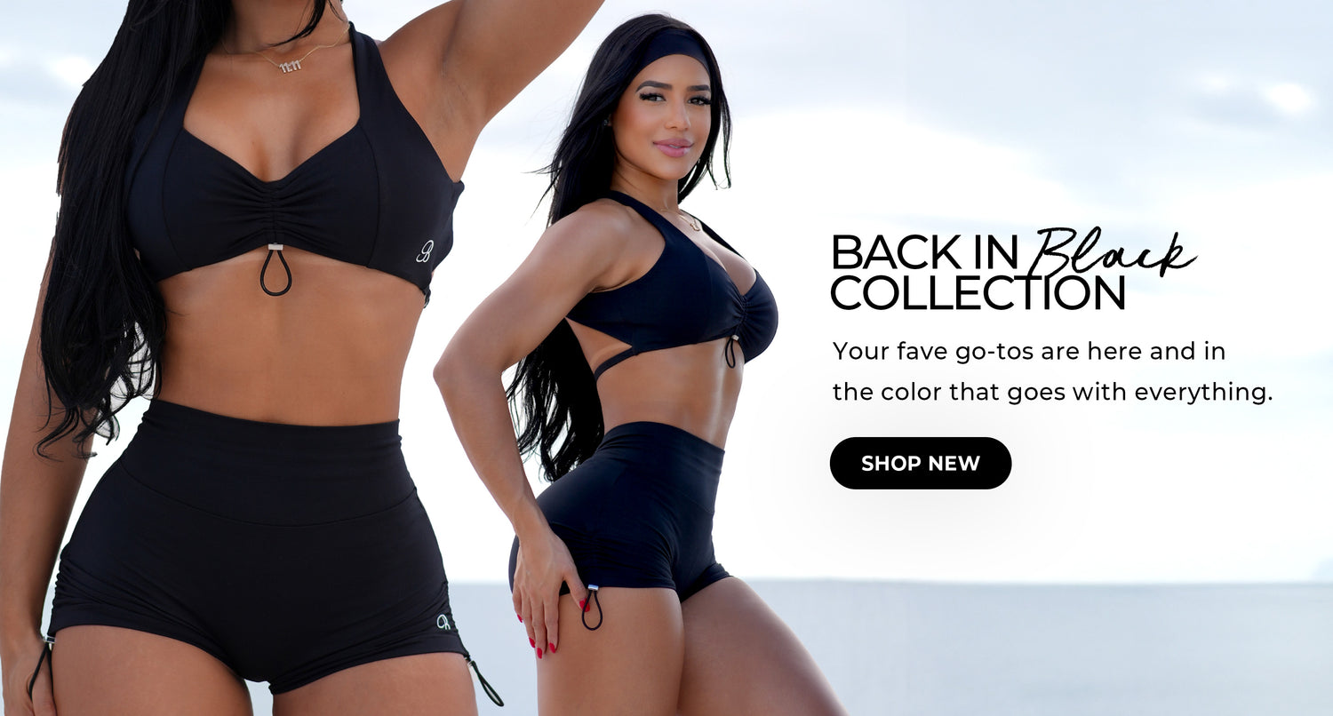 "Back in Black Collection" banner featuring a woman in a black workout set with cut-out detailing, standing confidently against a bright sky backdrop. Bold text: "BACK IN Black COLLECTION"; subtext reads: "Your fave go-tos are here and in the color that goes with everything." CTA button reads: "SHOP NEW."