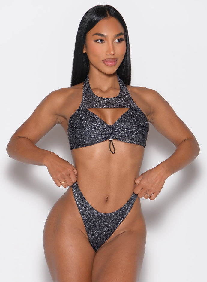 front profile view of a model looking to the left side wearing the Sunkissed Sparkle Bikini Bra in Black Diamond color