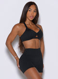 Bombshell Sportswear sports bra in black provides a sculpted side angle and medium-weight hold