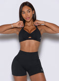 Chic black activewear bra features a scrunched center detail for a defined, comfortable gym fit