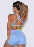 Bombshell Sportswear racerback sports bra in Vista Blue showcasing secure, adjustable straps.