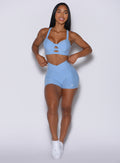   front profile picture of a model in our Tiny Waist Shorts in Bright Hydrangea color and a matching sports bra