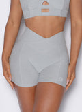 close up front view of a model wearing our tiny waist shorts in cloud color