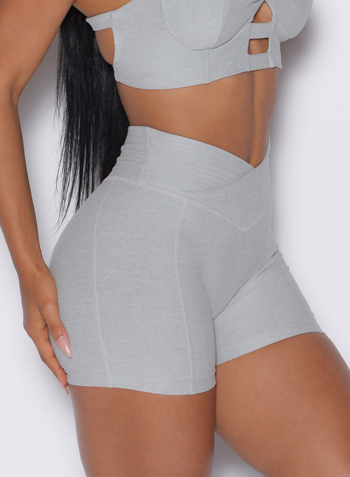 close up right side view of a model wearing our tiny waist shorts in cloud color