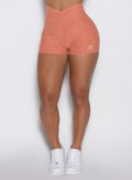 close up front view of a model wearing the Tiny Waist Tie Shorts in spiced maple color