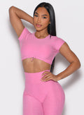 front profile view of a model wearing the Toggluxe Tee in Bubblegum color paired with the matching leggings 