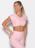 front profile view of a model looking to the right side wearing the Toggluxe Tee in Candy color