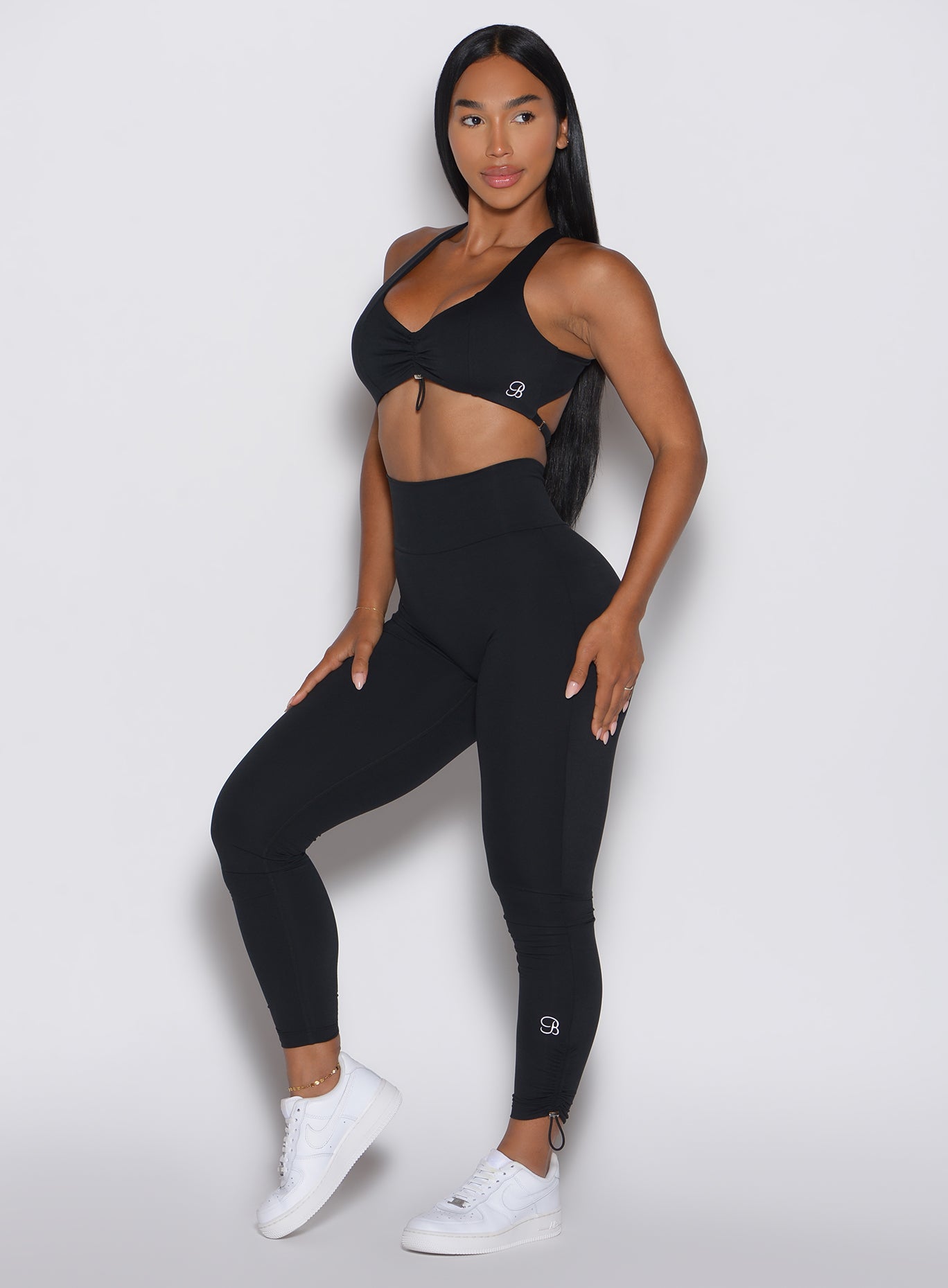 Black high-waisted Toggle Pull Leggings in black with an internal booty scrunch for gym gains.
