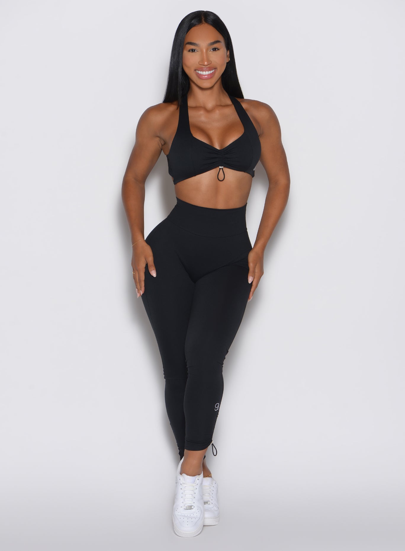 High-waisted Black Toggle Pull Leggings featuring adjustable side drawstrings for a custom fit.