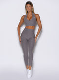front profile view of a model wearing the Toned 7/8 Leggings in Champion Gray color