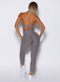 back profile view of a model wearing the Toned 7/8 Leggings in Champion Gray color