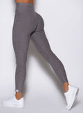 close up left side view of a model wearing the Toned 7/8 Leggings in Champion Gray color