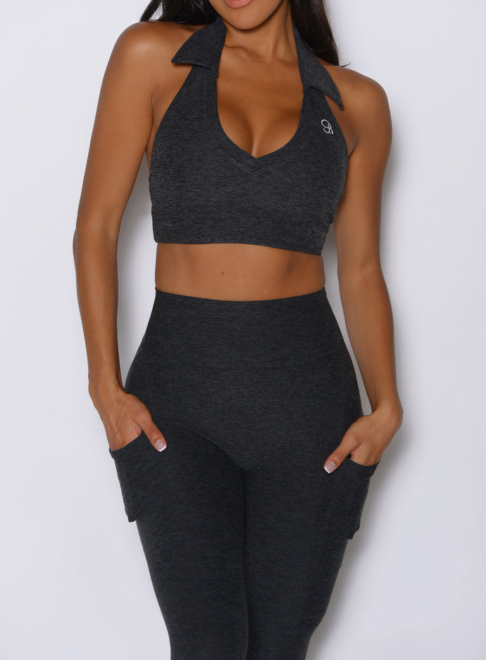close up front view of a model wearing the Toned 7/8 Leggings in Charcoal color