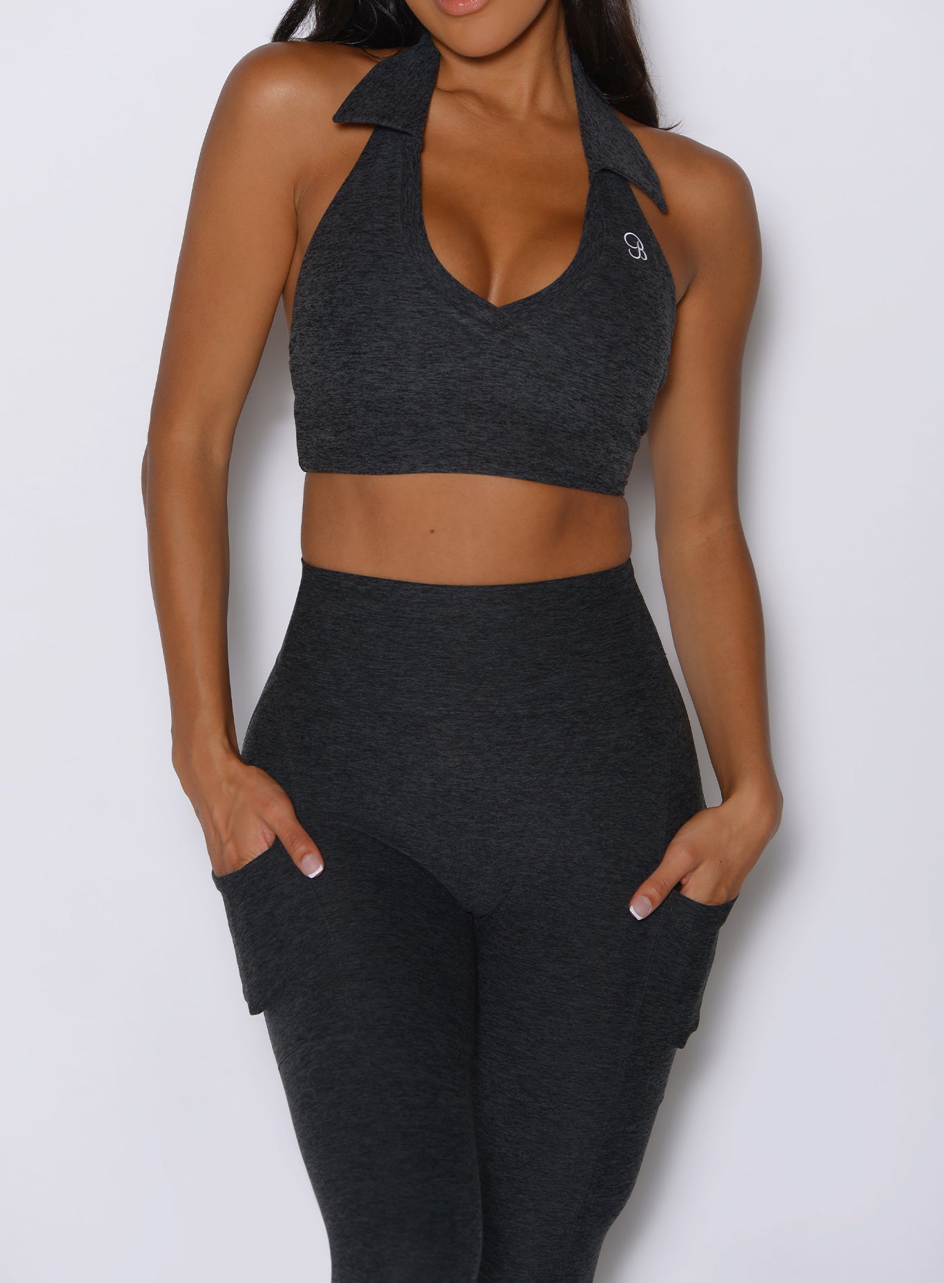 close up front view of a model wearing the Toned 7/8 Leggings in Charcoal color