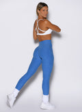 back right side profile view of a model wearing the Passion Sports Bra in white color
