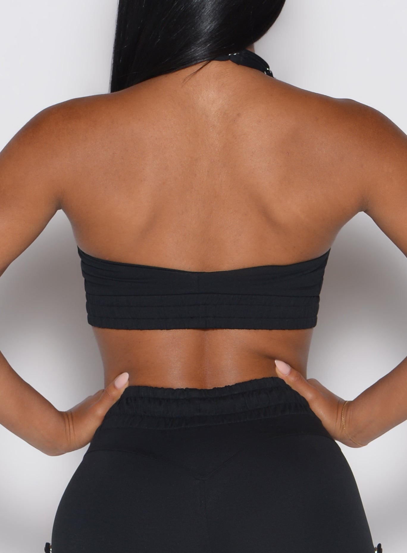 Black Trailblaze Sports Bra featuring a strappy crisscross back and sculpting performance fit.