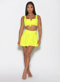 Model facing forward wearing our Tropical Tease Skirt in Neon Yellow color and the matching Tropical Tease Bikini Top