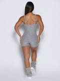 model viewed from the back side wearing the True form bodysuit shorts in dark and stormy color