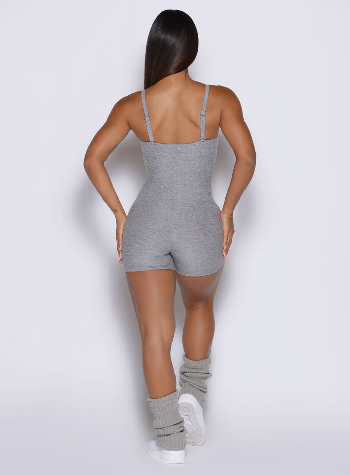 model viewed from the back side wearing the True form bodysuit shorts in dark and stormy color