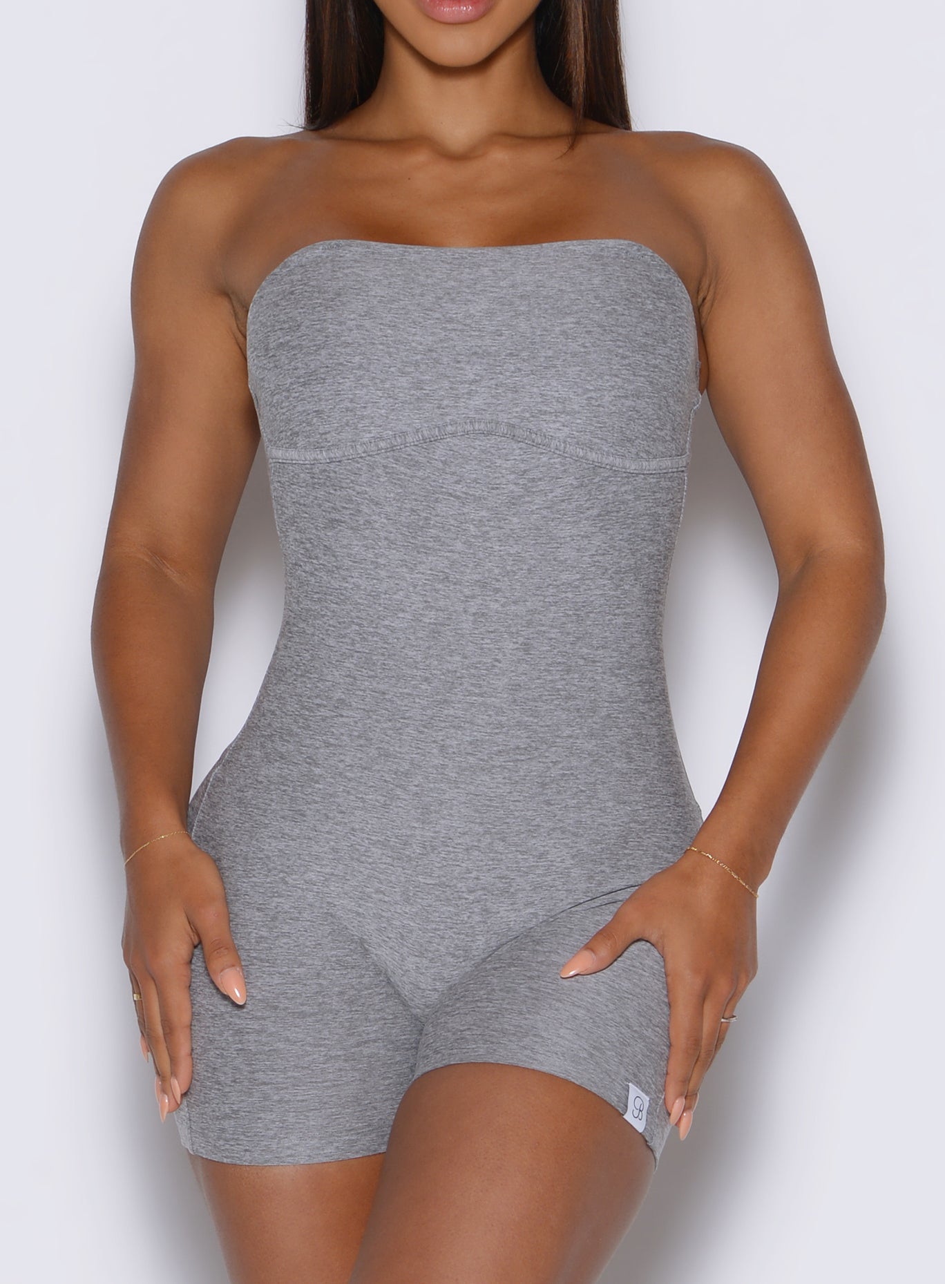 close up front view of a model wearing the True form Bodysuit shorts in dark and stormy color