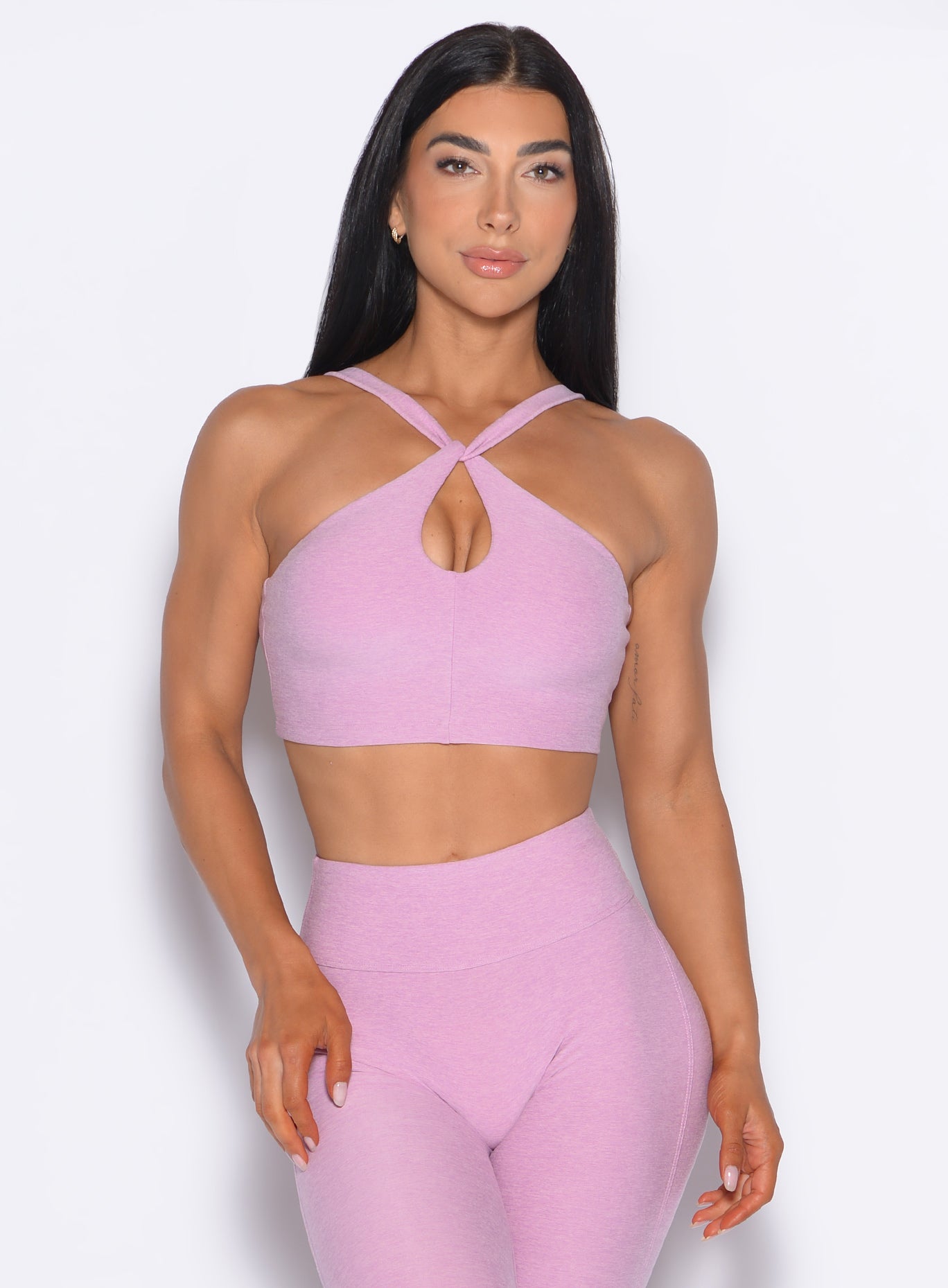 Fondant Twist Up Bra with a chic criss-cross neckline and keyhole detail for yoga and training.