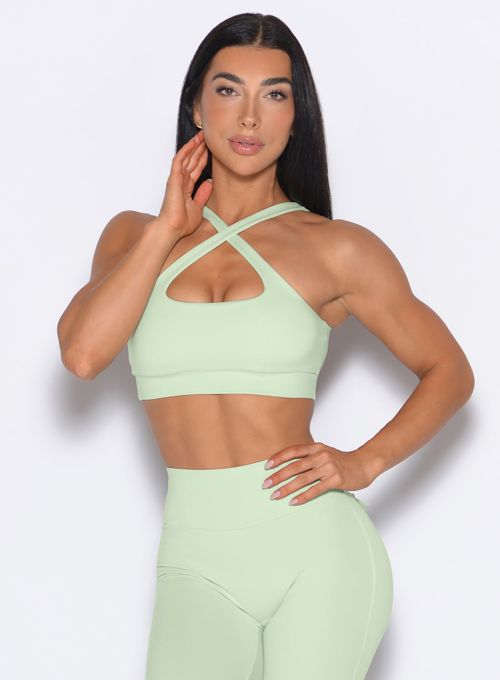 Front view of model wearing green activewear set