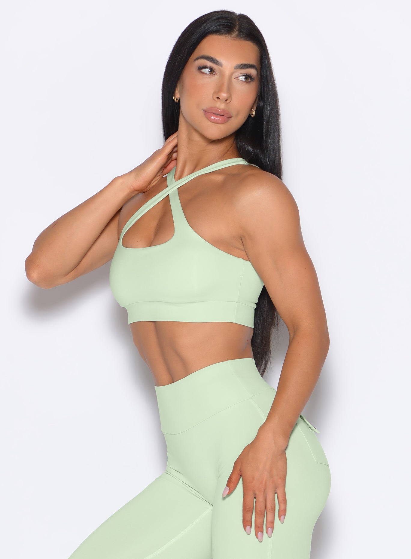 Cool Matcha Two Way Bra with adjustable slim straps and side-sculpting seams for a versatile gym fit.