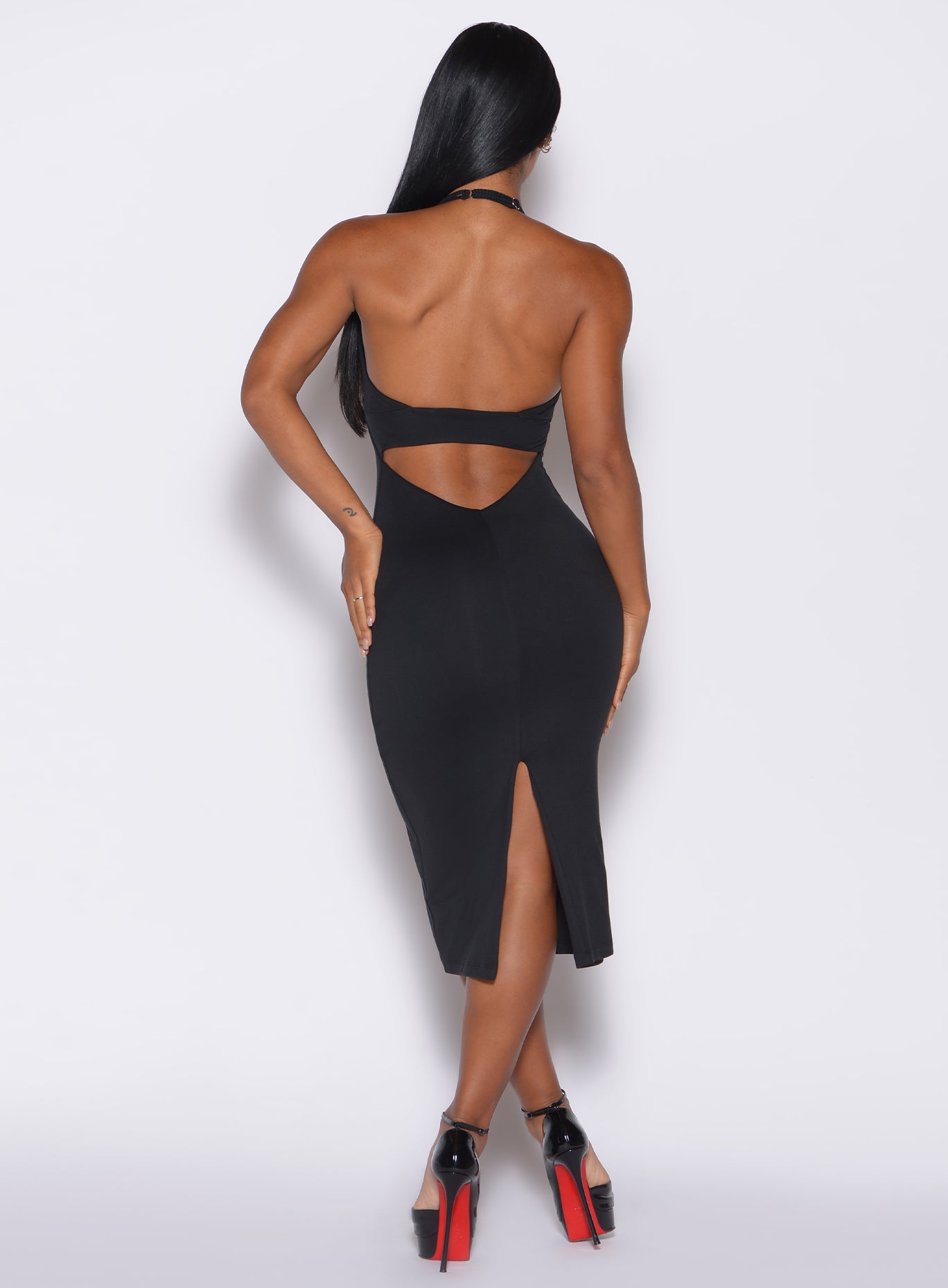 back profile view of a model wearing our black unforgettable dress