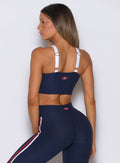 Back view of cosmic blue United Tank showing comfortable wide adjustable straps and the logo patch.