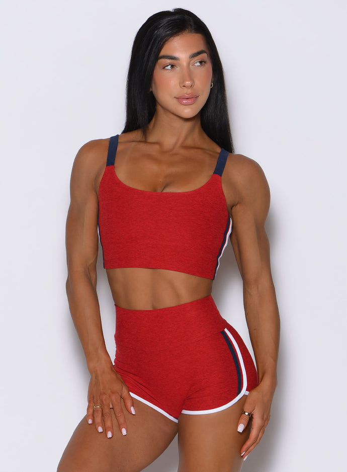 Sunset red United Tank featuring sporty contrast binding and a flattering, wide-strap scoop neck